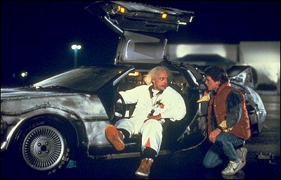 Michael J Fox and Christopher Lloyd in the De Lorean time machine from Back to the Future